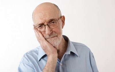 An older man in need of root canal therapy in Wayland.