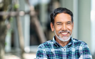 An older man smiling