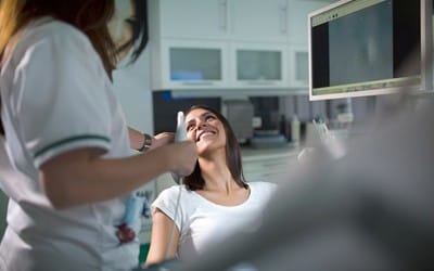 Patient smiling at her dentist in Wayland.