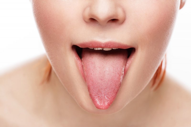 A woman sticking out her tongue.