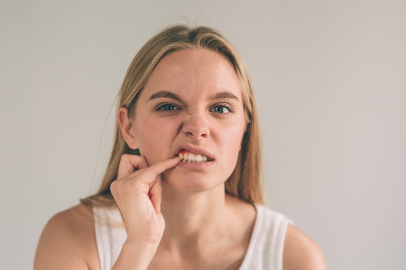 Woman with damaged tooth in need of a root canal